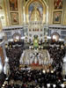 Russian Orthodox church clerics and believers stand around the casket of the late Patriarch Alexy II, center, placed for public viewing in Moscow's Christ the Savior Cathedral, Sunday, Dec. 7, 2008. Alexy II, who died Friday at age 79, led the church for 18 years, from the last year of the officially atheistic Soviet Union through a massive revival that saw it become the world's largest Orthodox church. Alexy's body was taken Saturday to the huge Christ the Savior Cathedral for three days of public viewing and a Tuesday funeral. (From  AP Photo by STR)