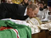 Russia's Prime Minister Vladimir Putin kisses the body of Russian Orthodox Patriarch Alexiy II in the Christ the Saviour Cathedral in Moscow December 9, 2008. Russia bade farewell on Tuesday to Orthodox Patriarch Alexiy II at a grand, pomp-filled funeral ceremony, with speakers praising him for reviving the nation's Christian faith after decades of communist atheism. (From Reuters Pictures by REUTERS)
